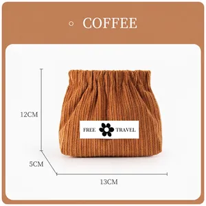 Detail view of coffee corduroy pouch with size 13x12x5cm and Free Travel patch