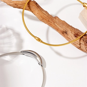 Chic gold and silver snake chain necklaces made of premium titanium steel on white surface