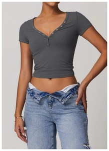 Close-up of charcoal grey ribbed gym top featuring a U-neck with metal button details