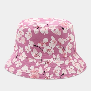 Detail shot of pink cherry blossom print and stitching on canvas bucket hat