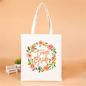 White canvas tote bag with floral wreath and Team Bride print for bachelorette party