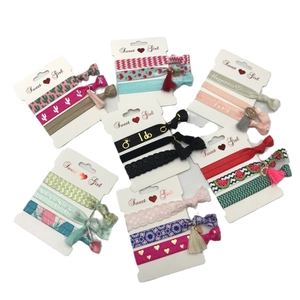 Set of floral and patterned elastic hair ties with Sweet Girl card packaging