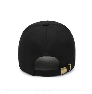 Detail of the black cotton baseball cap back with adjustable bronze metal buckle