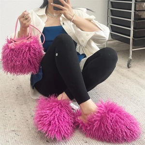 Matching pink faux sheepskin fluffy bucket bag and slippers styled in a Y2K aesthetic