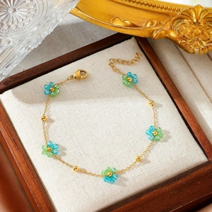 Minimalist 18K gold plated stainless steel bracelet with blue and green crystal flowers