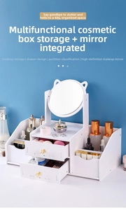 Detail of white makeup organizer with cat ear mirror and multiple storage drawers