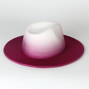 Detail of wool felt fedora featuring white and rose red gradient finish and soft texture