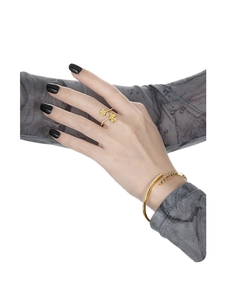 Detail of adjustable ginkgo leaf ring and gold crystal bracelet on a model hand