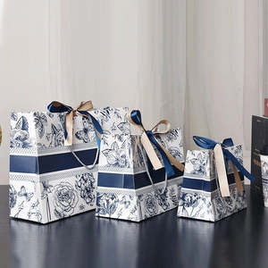 Three-piece floral paper gift bag set with silk ribbons and French vintage pattern