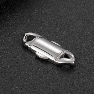 Polished silver stainless steel Cuban link clasp with smooth finish on black background