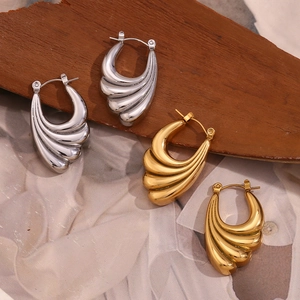 18K gold and silver stainless steel earrings with textured wave wing design