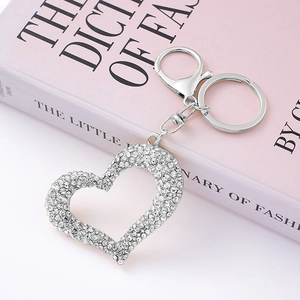 Close-up of heart-shaped keychain with sparkling rhinestones and lobster clasp
