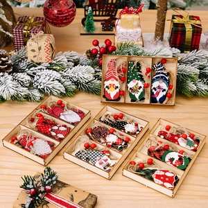 Set of 3 rustic Christmas wooden gnome ornaments with festive plaid patterns and twine hangers