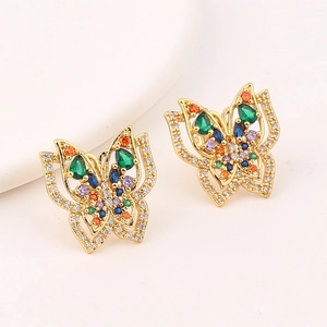 Detailed macro view of butterfly earrings with colorful pavé zircons and gold plating