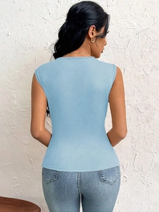 Close-up of light blue slim fit racerback tank top showing fabric texture and back cut