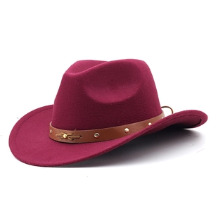 Close-up of western wool fedora hat with brown leather band and gold rivet accents