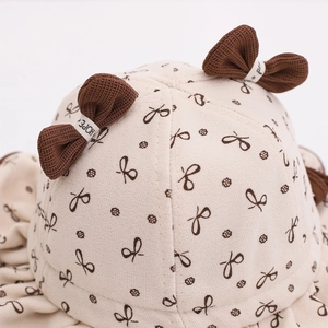 Chapeau bob en coton pour bébé beige avec imprimé nœuds bruns et ornements en 3D