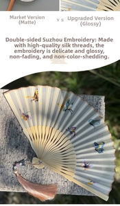 Detail of handmade double-sided silk embroidery with colorful butterflies on a folding fan