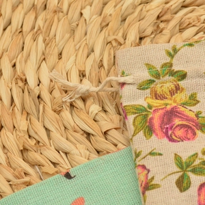 Close-up of floral drawstring pouch made of linen texture with pink rose patterns