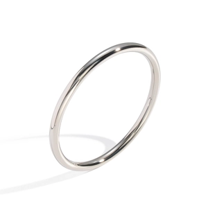 Minimalist silver stainless steel round bangle with polished mirror finish on white background