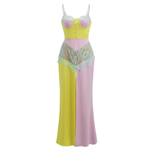 Detail of color-block pink and yellow dress with mint green lace trim and front buttons