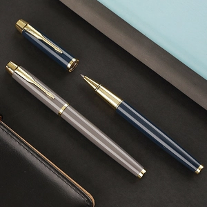 Executive metal rollerball pens in navy blue and grey with elegant gold arrow clip accents