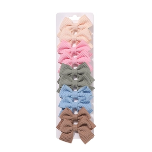 Set of 10 waffle fabric bow hair clips for girls in five pastel macaron colors
