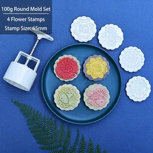 Macro detail of 100g mooncake mold set with round floral pattern stamps for baking