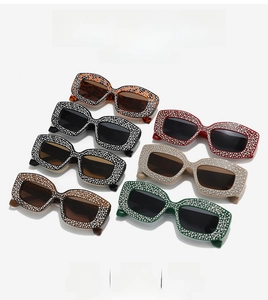 Detail view of multi-color rhinestone cat-eye sunglasses in seven assorted frames