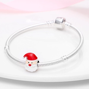 Silver snake chain bracelet featuring a festive red and white Santa Claus charm bead