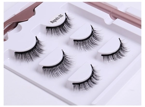 Macro shot of 5 pairs of magnetic false eyelashes with a rose gold applicator tool