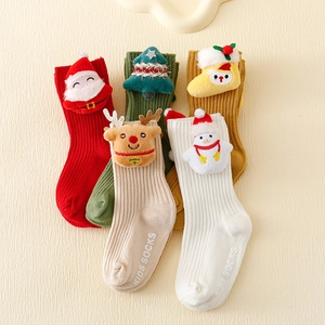 Five pairs of kids Christmas socks with 3D plush holiday motifs and non-slip soles