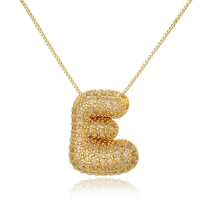Detailed macro shot of a gold-plated bubble letter E pendant encrusted with clear zircons