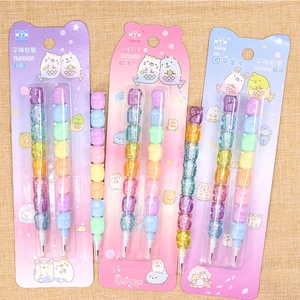 Detail of colorful non-sharpening bullet pencils with cute cartoon animal character tops