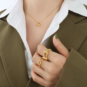 Minimalist oval pendant necklace and design rings set in 18K gold plated stainless steel