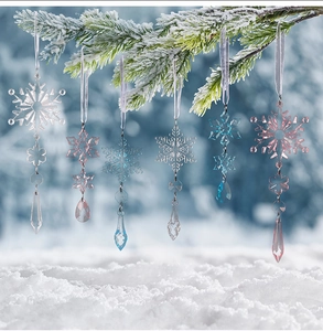 Detail of 6pcs acrylic Christmas snowflakes and icicle ornaments hanging on frosty pine branches