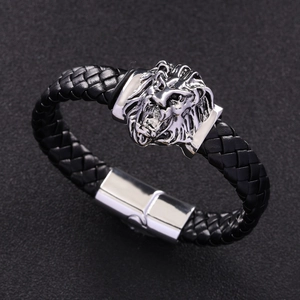 Detail of a braided black leather lion head bracelet for men with silver magnetic clasp