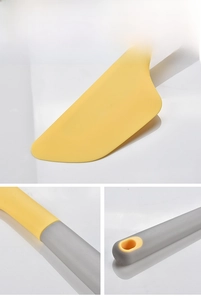 Macro details of bicolored silicone baking spatula featuring hanging hole and flexible edge