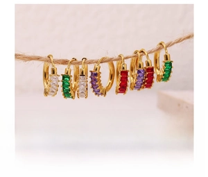 Close-up of titanium steel hoop earrings with colorful rectangular zircon gemstones