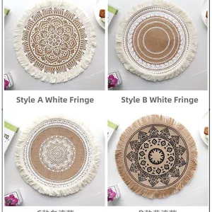 Detail view of round jute placemats with fringe edge and vintage mandala patterns