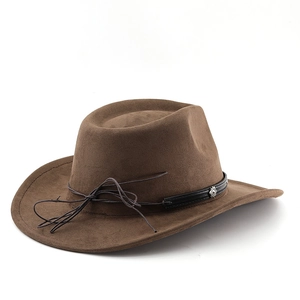 Macro detail of dark brown suede western hat with leather band and metal badge