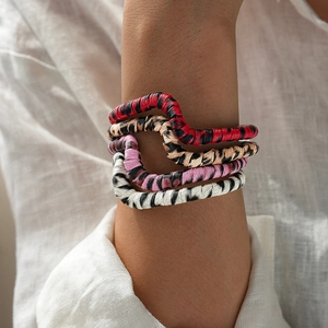 Retro animal print elastic bracelets featuring leopard and zebra textures on wrist