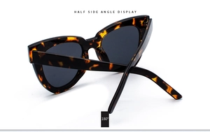 Detail of tortoise cat eye sunglasses with 180-degree flexible wide temples and dark lenses