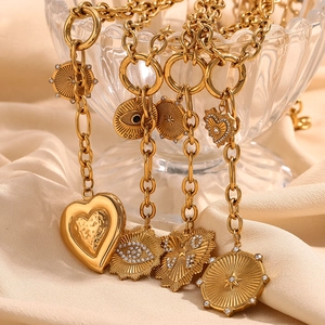 Chunky 18K gold plated O-chain necklace with heart and evil eye charms on satin