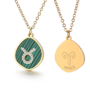 Gold stainless steel zodiac necklace featuring a green malachite pendant with Taurus symbol