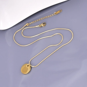 Minimalist gold snake chain necklace with round disk pendant and K18 hallmark