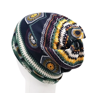 Detail of ethnic geometric pattern beanie showing bohemian knit texture and drape