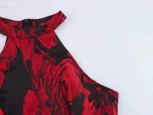 Detail of elegant halter neck maxi dress with red floral jacquard fabric and hidden zipper