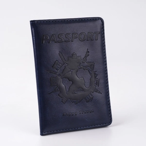 Close-up of dark blue PU leather passport cover with world map and landmark embossing