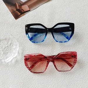Stylish oversized geometric sunglasses with water ripple patterns in black and red marble finish